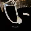 Gargantilla de collar de perlas de doble capa de rosa blanca estilo hada cadena para clavícula de lujo ligero nicho de alta gama para mujer