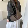 Bolso de lona con estampado de leopardo para mujer, nuevo modelo otoño/invierno 2026, bolso tipo dumpling de gran capacidad para el hombro para la escuela y el trabajo, bolso de hombro y cruzado
