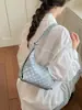 Bolso de axila de lunares con diseño de nicho coreano sensación de alta gama nuevo estilo 2026 moderno versátil para mujer de un solo hombro transfronterizo