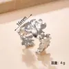 Joyería de Acero de Titanio de Moda Diseño Versátil Anillo de Flor Prensada en Aceite Resistente al Color Lujo Ligero Sensación de Alta Gama Anillo Abierto Ajustable