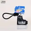 Nuevo llavero accesorio de instrumento musical de gato de cuero, lindo gatito de dibujos animados colgante de bolso de piano de cuero, pequeño regalo