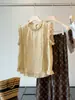 Projetada com um Senso de Artesanato, Esta Camisa sem Mangas para Mulheres Apresenta Bordados Pesados e Patchwork, um Novo Estilo de Moda de Verão que é Elegante e Juvenil, Realçando a Aparência