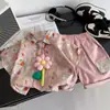 Roupas Infantis 2026 Verão Novo Comércio Exterior Camisa Tie-Dye Floral Tridimensional com Laço Conjunto Duas Peças Manga Curta Infantil Atacado
