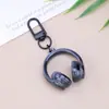 Llavero de Auriculares con Cabeza Tridimensional de Caramelo Sinfonía Acrílica Moda Más Fácil de Combinar Colgante Creativo para Bolsos Colgante para Pareja Mejor Amigo
