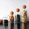 Venta al por mayor de frascos esféricos de corcho sellados para almacenar té, café y aperitivos multigrano.