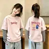 Nueva camiseta de estilo coreano para niñas, imitación de dos piezas, manga larga, camiseta básica de algodón puro para otoño, top versátil y elegante a la moda para niñas