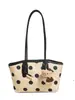 Bolso grande de mano popular para mujer 2026 versión coreana moda moderno bolso de hombro elegante para el día a día bolso tote de lunares moderno