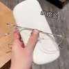 Populares en Xiaohongshu, montura de titanio ultraligera sin montura para mujer 20207, pura y delicada, que estiliza el rostro, venta al por mayor de fábrica, lentes con forma de mariposa