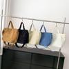 Bolso de mujer portátil de gran capacidad, primavera y verano 2024, nuevo bolso de tela de pana de estilo coreano, bolso bandolera informal sencillo.