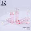 Tubo de esmalte de labios redondo transparente rosa, tubo de rubor líquido, varilla de pincel gruesa, material de embalaje de plástico.