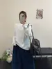 Camiseta de Manga Larga Minimalista Versátil de Estilo Nuevo para Mujer de Principios de Primavera Coreana con Pequeña Etiqueta de Cuero en la Espalda y Costura Central, Corte Holgado y Efecto Adelgazante