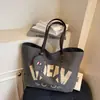 Bolsa Tote Grande de Lona Casual para Viajes de Primavera 2026 Bolso de Hombro Simple de Moda con Estampado