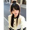 Cardigan de tricô com mangas compridas vazado em color blocking com senso de design feminino outono inverno petite estilo coreano gentil macio pegajoso casaco suéter moderno