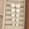 Pendientes de Bollo al Vapor Perla Estilo Mismo Fiebre Blanco Brillante Lujo Accesible Exquisitos de Moda Nicho Pendientes de Moda Simples de Gama Alta