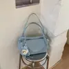 Nueva bolsa tipo almohada transfronteriza, gran capacidad, bolso de hombro elegante y moderno, sensación de alta gama 2026, adecuado para el trabajo y los desplazamientos, bolso de axila para mujer