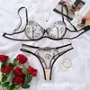Lencería sexy transparente de malla transfronteriza en stock para venta al por mayor, conjunto sensual y seductor de tres piezas: sujetador y tanga