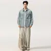 Ropa de Hombre Xintang 2026 Primavera Nuevo Estilo Camisa de Mezclilla Azul Claro Lavada y Desgastada Camisa de Trabajo de Lyocell