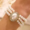 Novo Pulseira de Pérolas Multicamadas Transfronteiriça Conjunto Feminino Estilo Francês Design de Nicho Luxo Leve Pulseira Pulseira com Pingente de Amor