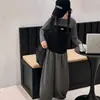 Conjunto de otoño para niña 2026 nuevo estilo coreano moderno versátil conjunto infantil de dos piezas con top de imitación de dos piezas