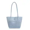 Bolso de hombro hueco estilo coreano inspirado en ins, elegante bolso cubo para mujer para la oficina, nuevo bolso tote personalizado para viajes de verano 2026