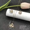 Conjunto de pendientes y collar Xuping estilo vintage de nicho europeo y americano transfronterizo, conjunto de joyería elegante de aleación de cobre, venta al por mayor y hecho a medida