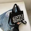 Tailandia Mujer Gentil estampado de letras de color bolsa pequeña de lona 2023 nueva textura bolso de hombro casual