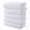 Venta al por mayor de fábrica toalla blanca desechable 30*70 hotel Hotel salón de belleza Barbería baño toalla blanca al por mayor