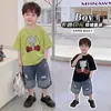 Conjunto de Manga Corta para Niños 2026 Nuevo Atuendo de Verano Estilo Coreano Camiseta de Dibujos Animados Pantalones Cortos de Mezclilla Bebé Delgado Conjunto de Dos Piezas Moderno