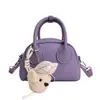 Bolsa de Boliche de Mão Fashion para Mulheres 2026 Novo Modelo Bolsa Transversal Design de Nicho Textura Bolsa de Ombro Casual