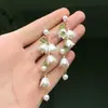 Europa y Estados Unidos joyería transfronteriza Mori dulce fresco pequeña Lirio orquídea cadena para el cuello borla aretes de perlas de imitación conjunto de collar