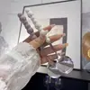 Exquisita cuchara de acero inoxidable de cuatro colores perlados con mango de cerámica, adecuada para uso doméstico, cenas de estilo occidental, moderna y visualmente atractiva