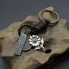 Llavero creativo para hombre, de aleación, con diseño de flor, de piel de vaca trenzada vintage, de bronce.