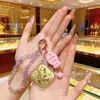 Llavero colgante creativo de oro puro 999, accesorio versátil y moderno para bolso, adecuado como pequeño regalo para eventos o puestos
