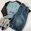 Jeans para niños Mai Bao 2026 estilo nuevo de invierno para niños pantalones elegantes de pierna curva con estrellas ajuste holgado pantalones dropshipping