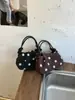 Bolsos de diseñador únicos para mujer 2026 nuevo bolso de moda de lunares estilo coreano elegante versátil para hombro y bandolera