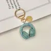 Llavero de Audífonos con Pedrería de Cristal Llavero Musical Completamente Cubierto de Pedrería Adorno Colgante de Cuerda de Diamante para Bolso Accesorios Llavero de Coche