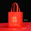 Bolsa de regalo festiva roja no tejida portátil bolsa de la suerte empaque de boda regalo de boda Año Nuevo Chino bolsa con palabra de la suerte en stock