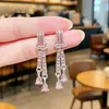 Nuevos Pendientes Largos de Lujo Ligero con Sentido de Alta Gama Temperamento Elegante Diseño de Nicho Orejeras de Moda Nudo Colgante de Pendiente de Gota de Agua