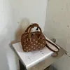 Bolso de mano de nicho estilo coreano Shuai Mi Jia bolso bowling 2026 otoño nuevo bolso de hombro de lunares de moda bolso cruzado para el día a día