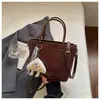 Bolso de mano de moda transfronterizo para mujer, nuevo bolso tipo cubo de alta moda y tendencia, bolso simple de hombro y cruzado