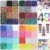 Caja de 24 compartimentos moderna y popular de diamantes de resina jelly de color AB con base plana, empaquetada para arte de uñas DIY, accesorios pequeños, venta al por mayor