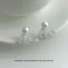 Aretes de aguja de plata S925 con un diseño de falda de encaje inspirado en Chanel, detalles de perlas y un sofisticado diseño calado, que ofrecen un look elegante y exquisito.