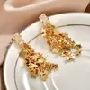 Pendientes de pentagrama de moda con incrustaciones de circonita, estilo largo, pendientes de botón con borla de estrella súper de cuento de hadas, lujo ligero, moda de alta gama, pendientes elegantes y con estilo