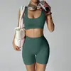 Nuevo conjunto de yoga transfronterizo: Shorts de fitness tipo durazno sin costuras que levantan los glúteos con almohadillas en el pecho, top deportivo y sujetador de yoga