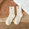 Calcetines de mujer otoño e invierno nuevos en el tubo de color sólido cálido terciopelo acolchado calcetines de invierno de rizo calcetines de toalla de invierno para mujer