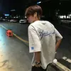 Camiseta de Manga Corta Bordada con Copos de Nieve Estilo Callejero Americano para Hombres y Mujeres 2026 Verano Nuevo Estilo Suelta y Versátil Tops de Pareja Modernos