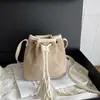 Bolso bandolera plisado de moda extranjera elegante para mujer otoño retro simple temperamento casual versátil bolso de cubo de un solo hombro