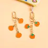 Llavero de Fruta de Aleación Creativo Manzana Caqui Naranja Colgante para Bolso Decoración para Mochila de Estudiante Colgante Pequeño Regalo