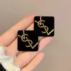 2023 Nuevos pendientes grandes exagerados con diseño geométrico hueco y esmaltado en forma de gota para mujer, pendientes de estilo frío con diseño de nicho de alta calidad