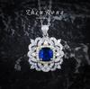 Moda retro de alta gama flor anillo azul Tan sang collar con colgante de diamante de alto carbono Princesa aretes de botón de tesoro colorido traje Europeo y Americano